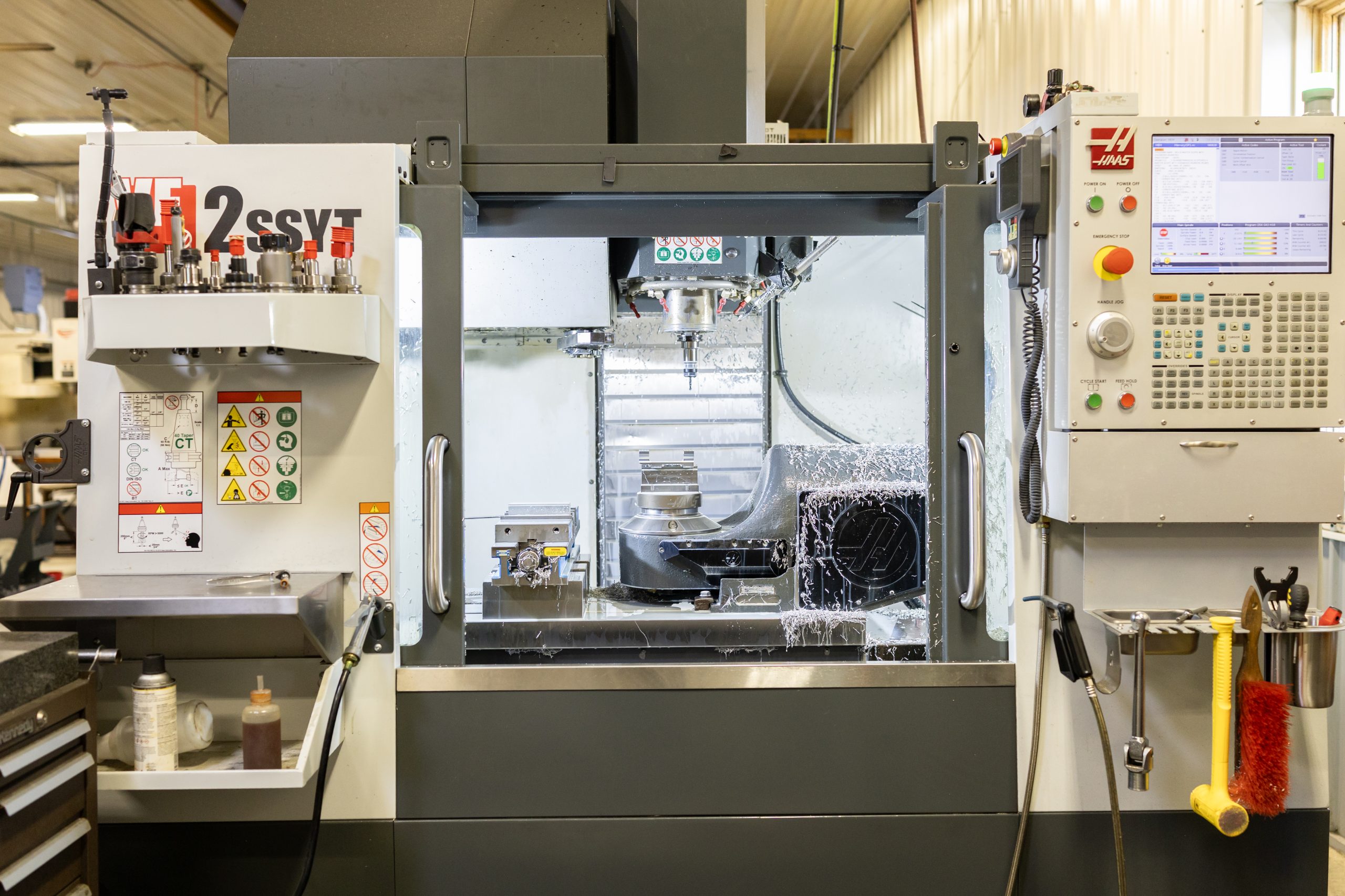 CNC machine Veit Tool 5-axis CNC machine producing precision machined parts in Davison, Michigan.